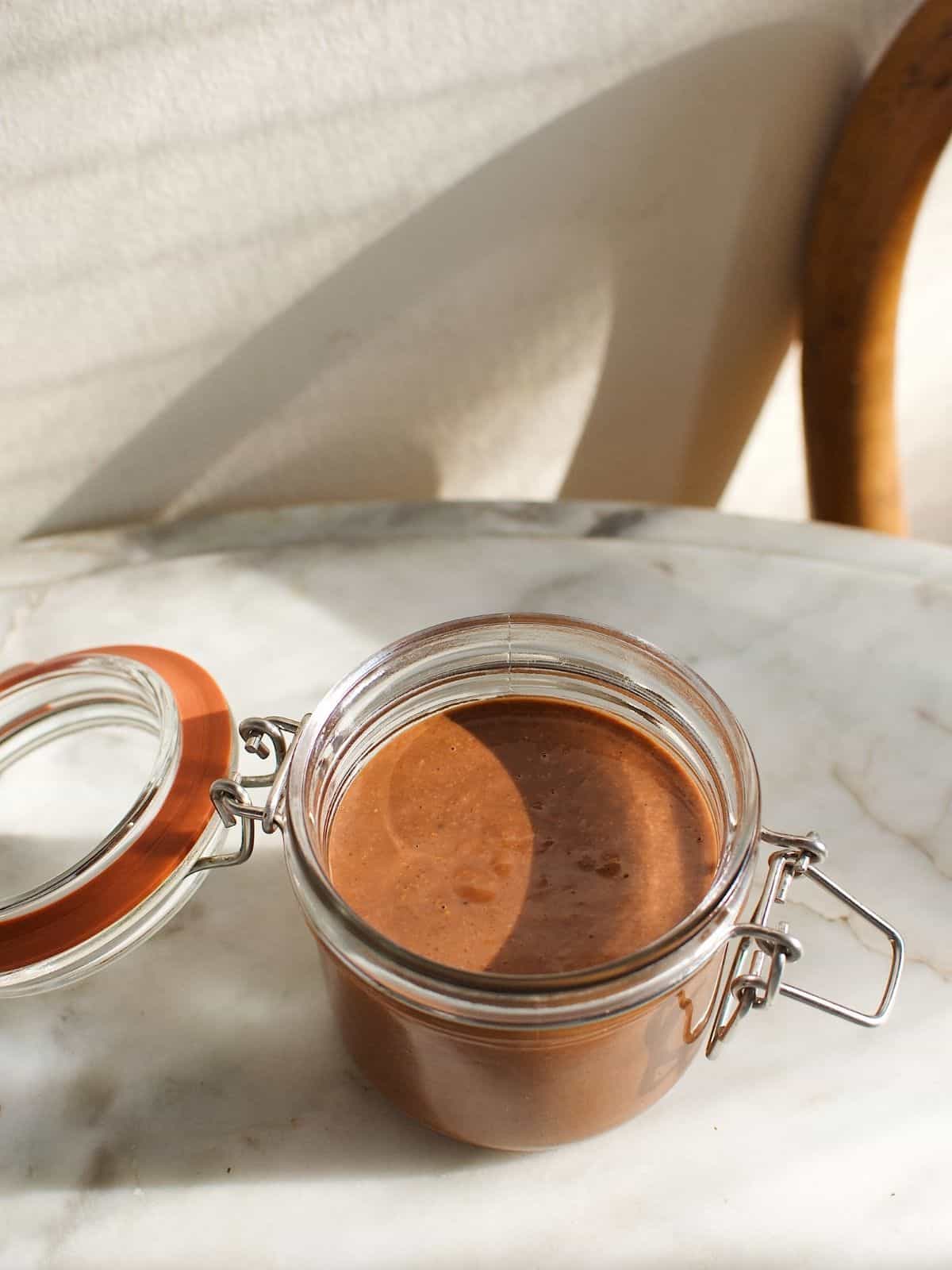freshly-made gianduja in a glass container.