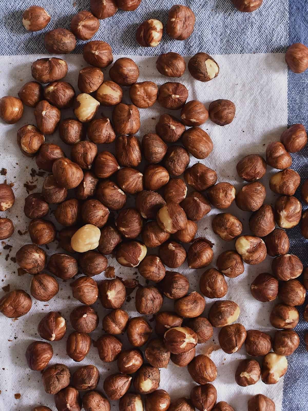 Hazelnuts on top of a table.
