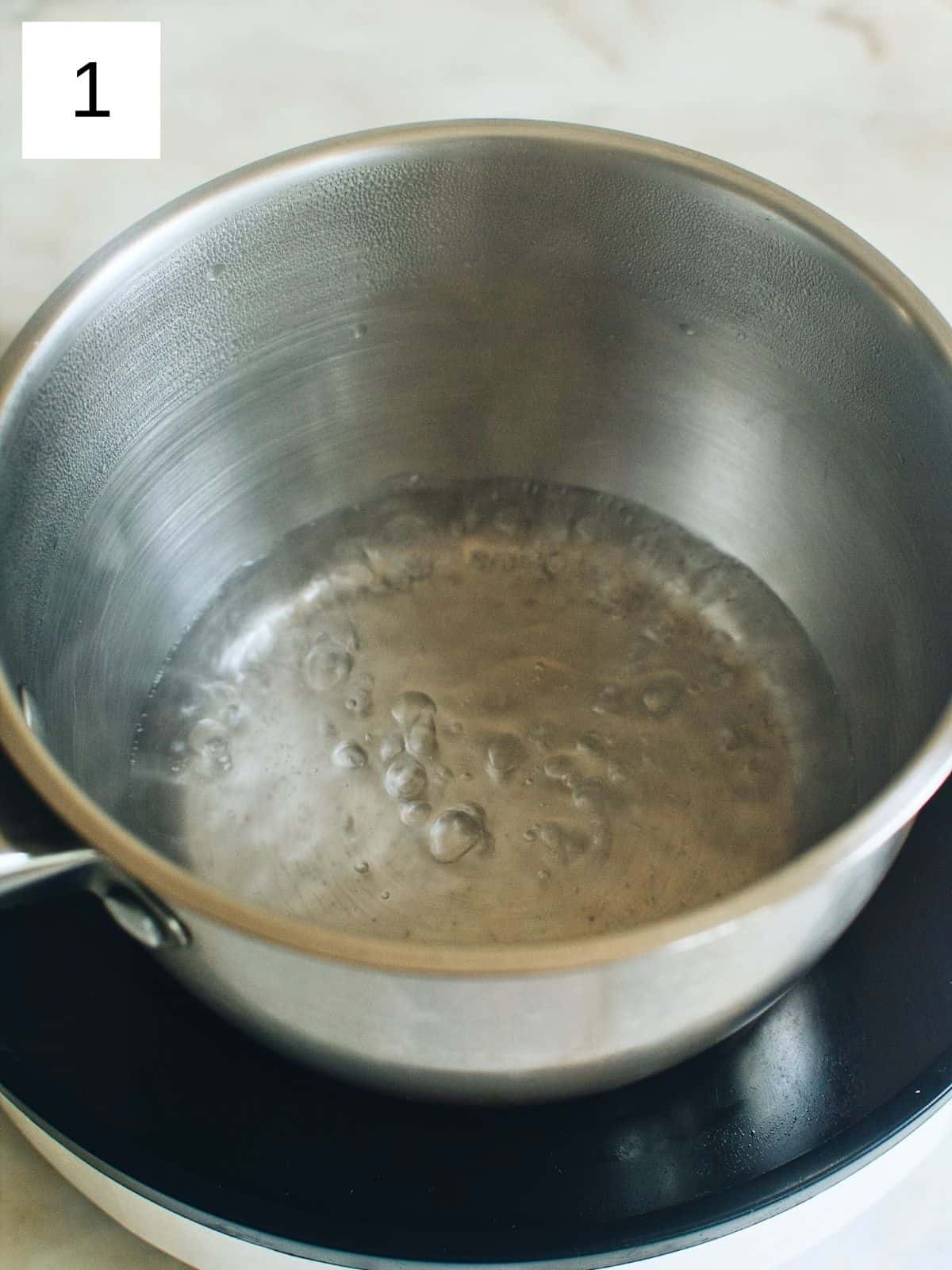 boiling water in a pot.