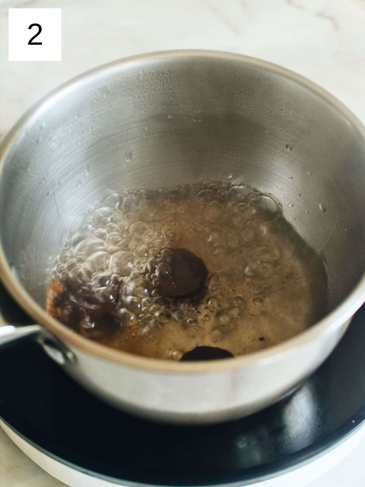 pieces of tableya in a boiling pot of water.