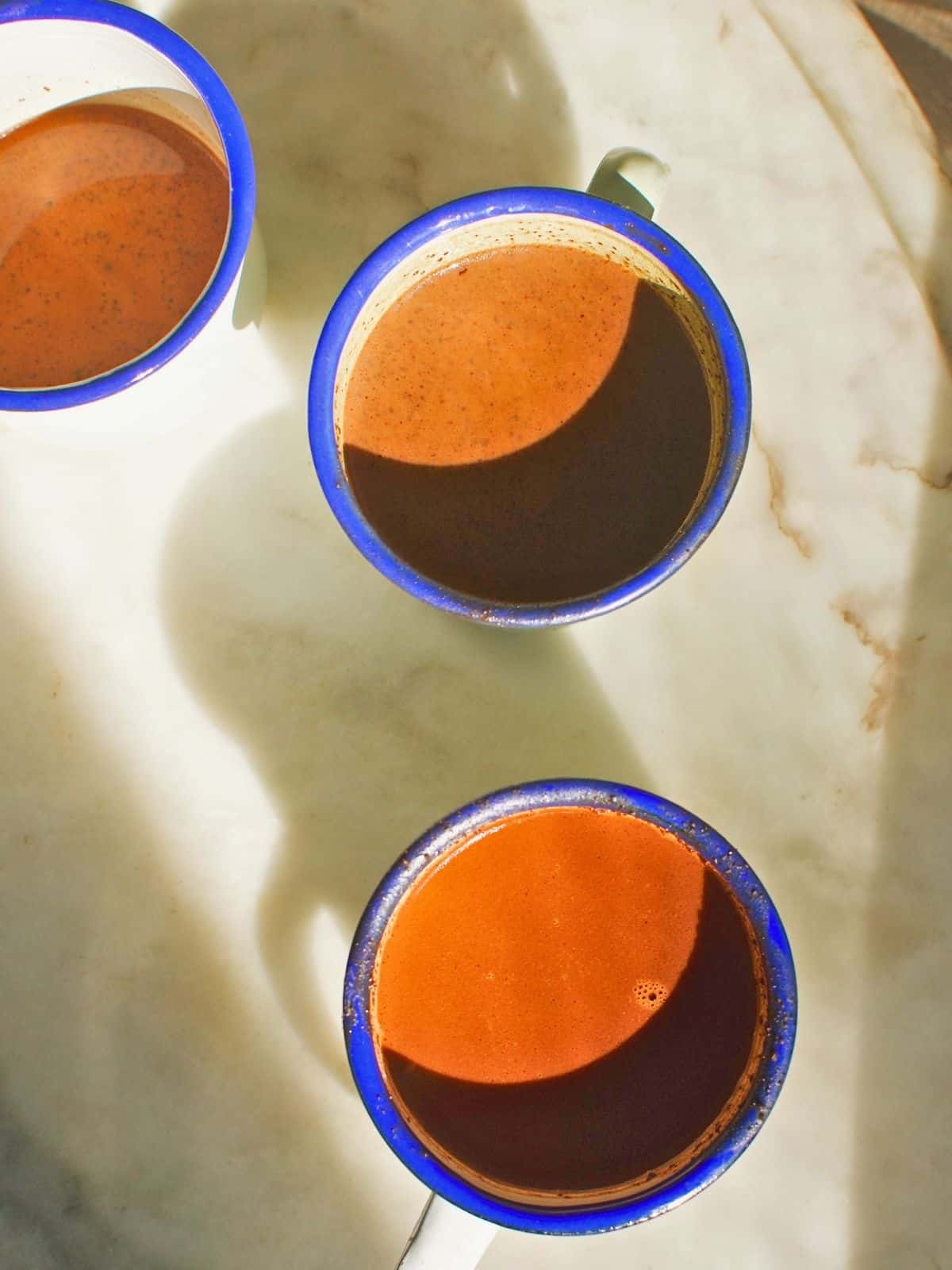 three mugs of hot chocolate (sikwate).