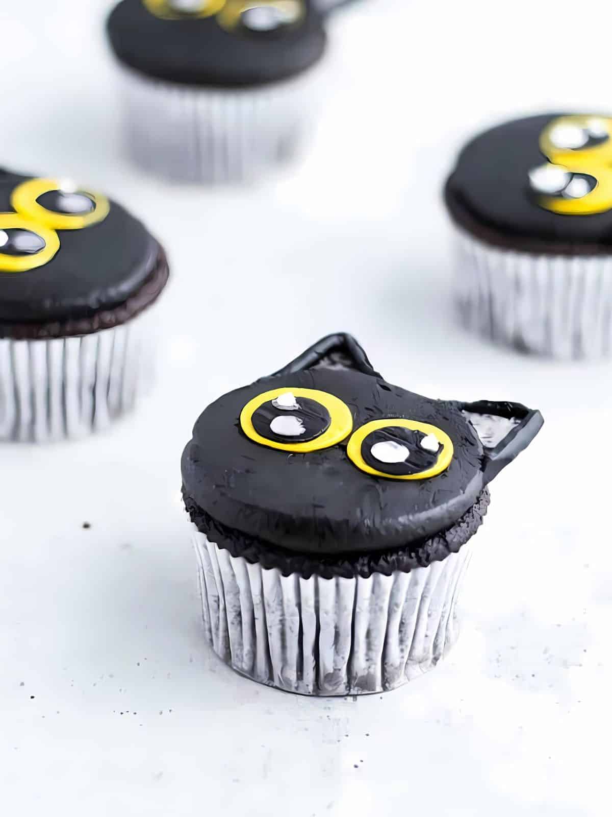 Black cat themed cupcakes.