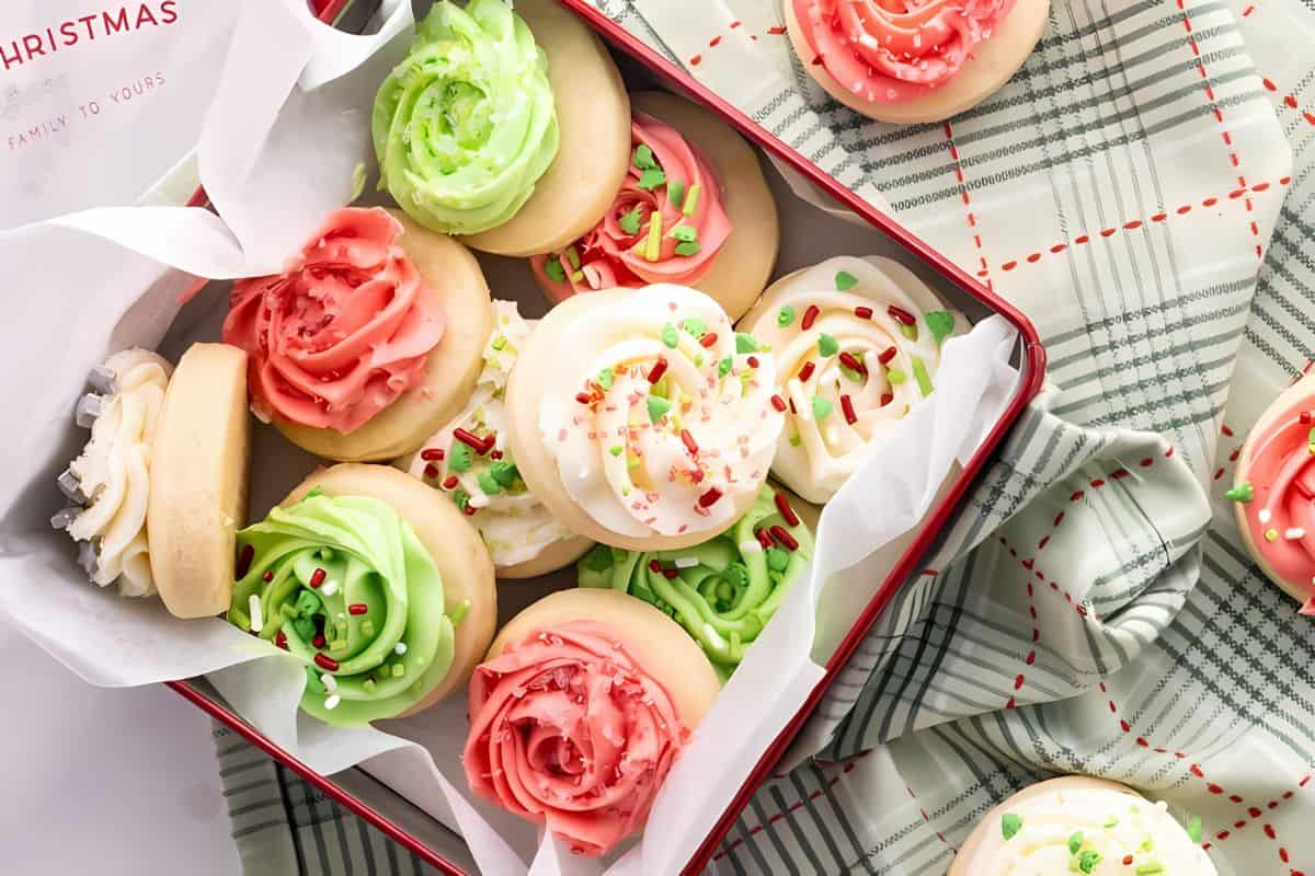 Lofthouse sugar cookies topped with flower-shaped hard frosting and sprinkles.