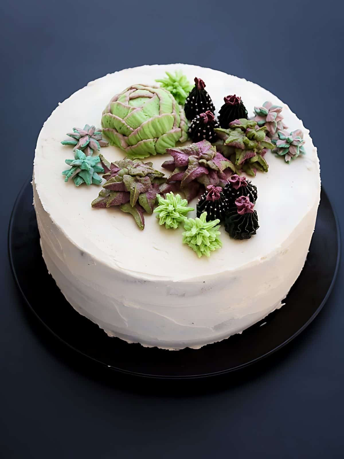 Peanut Butter Banana Succulent Cake topped with plant-like designed candies.