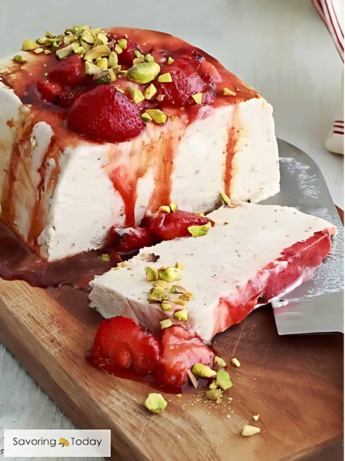 Strawberry Semifreddo with Pistachios Balsamic on a chopping board.
