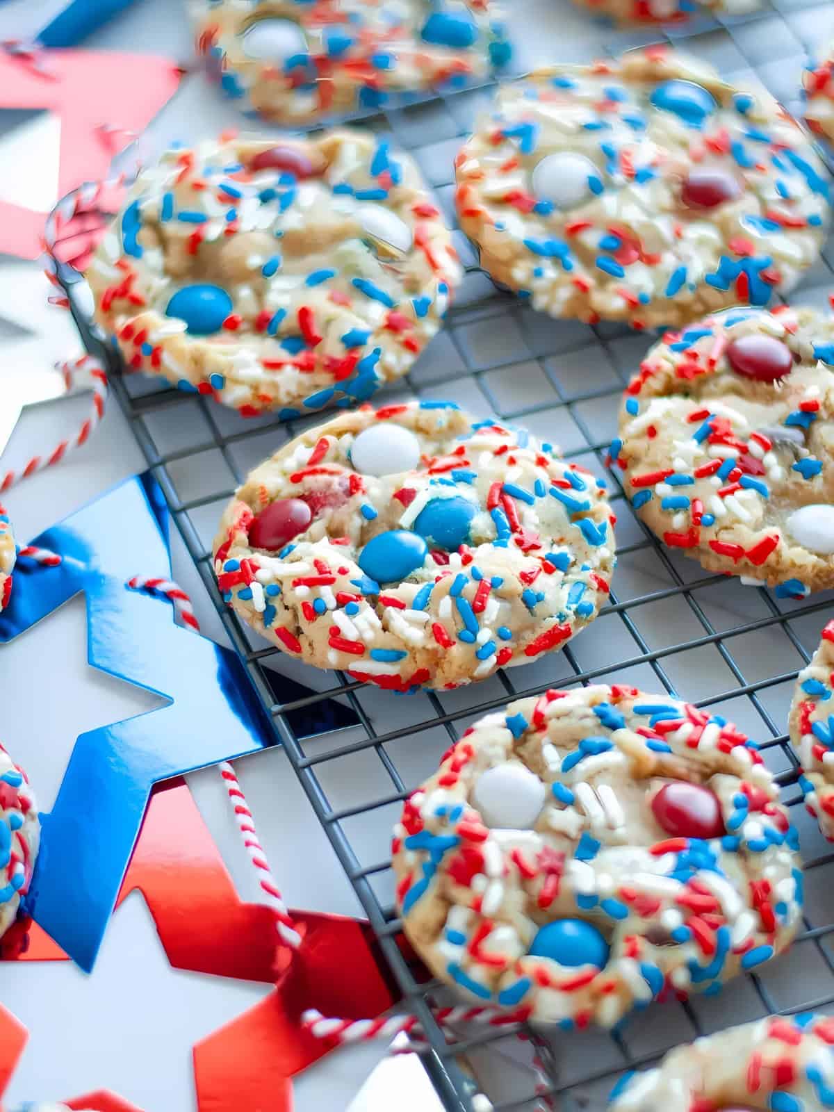 4th of July themed cookies topped with sprinkles and M&M's