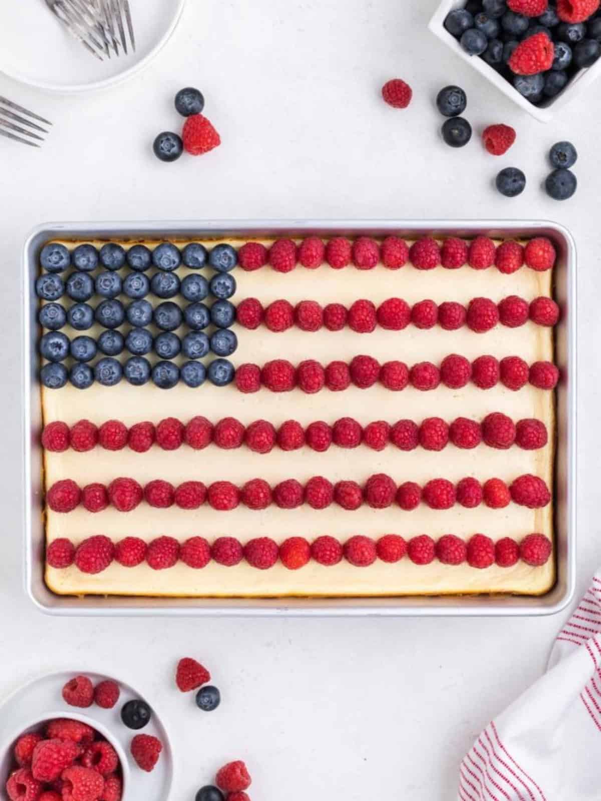 American flag themed red white and blue bars topped with raspberries and blueberries.