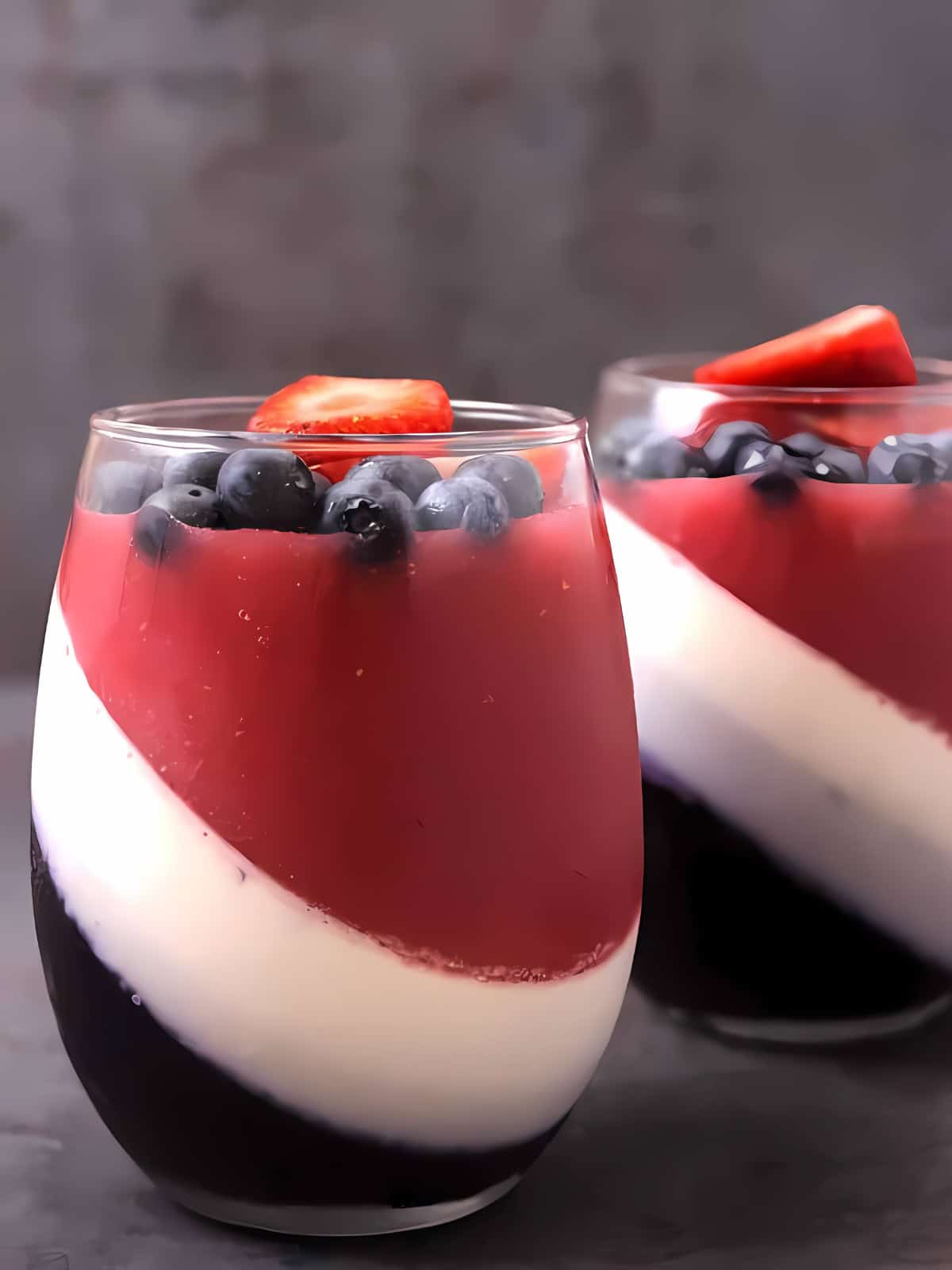 4th of July themed panna cotta with strawberries and blueberries.