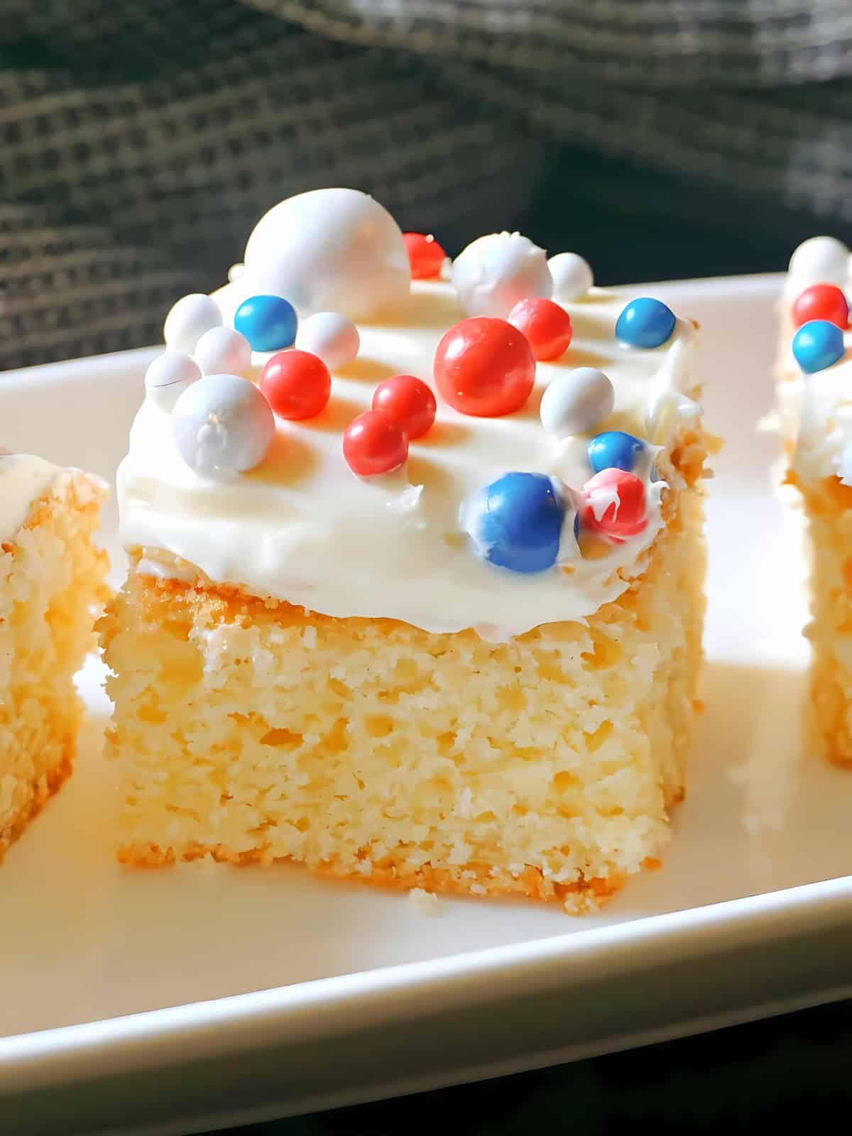 Traybake sponge cakes with red white and blue toppings.