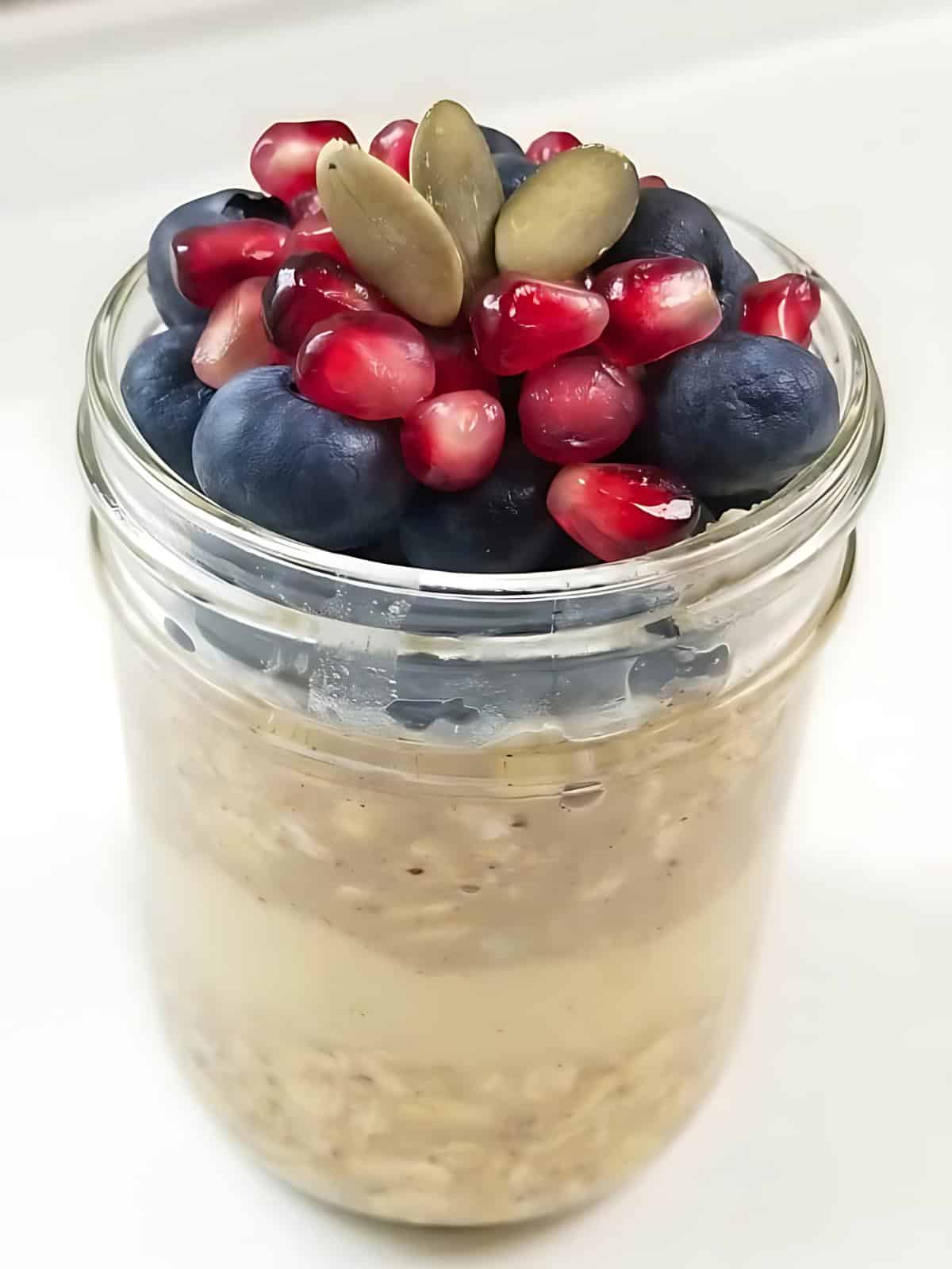 Vegan overnight oats in a glass jar.