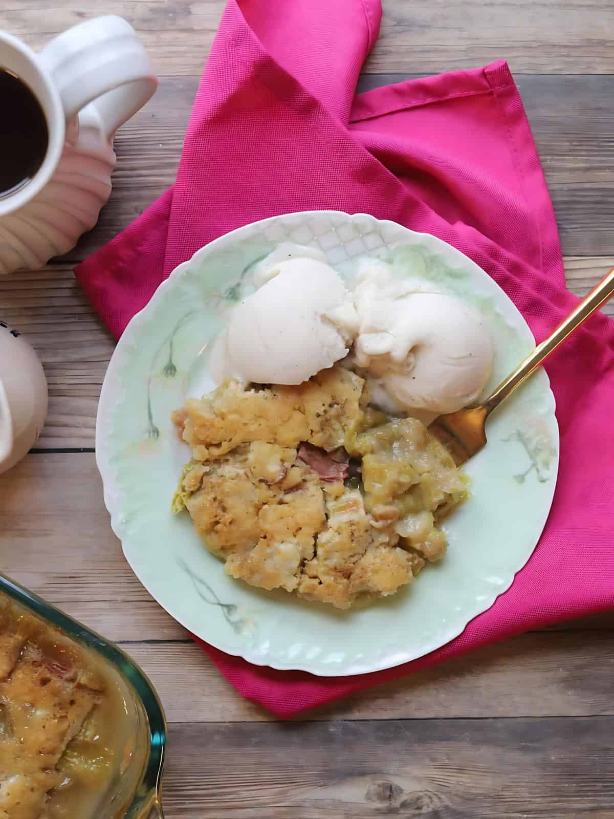 A serving of rhubarb pudding cake on a plate.