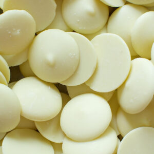 Pieces of disk shaped white chocolate.