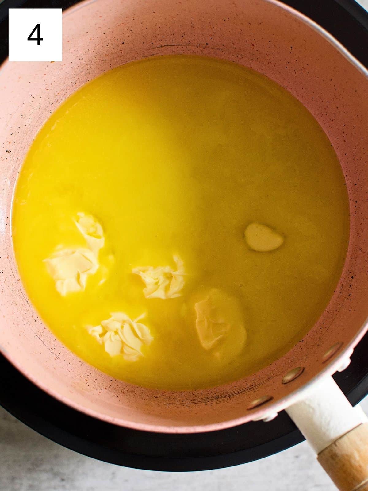 Melted butter in a heated pan.