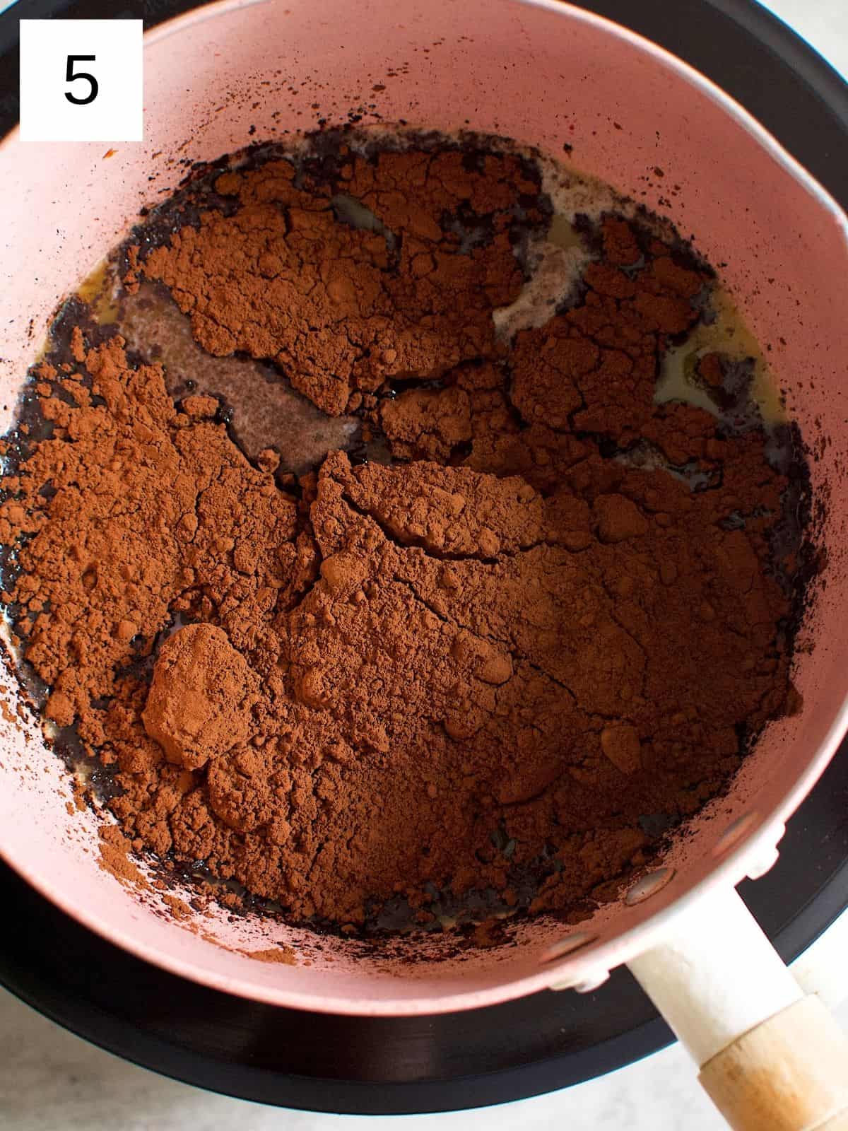 Cocoa powder added to melted butter.