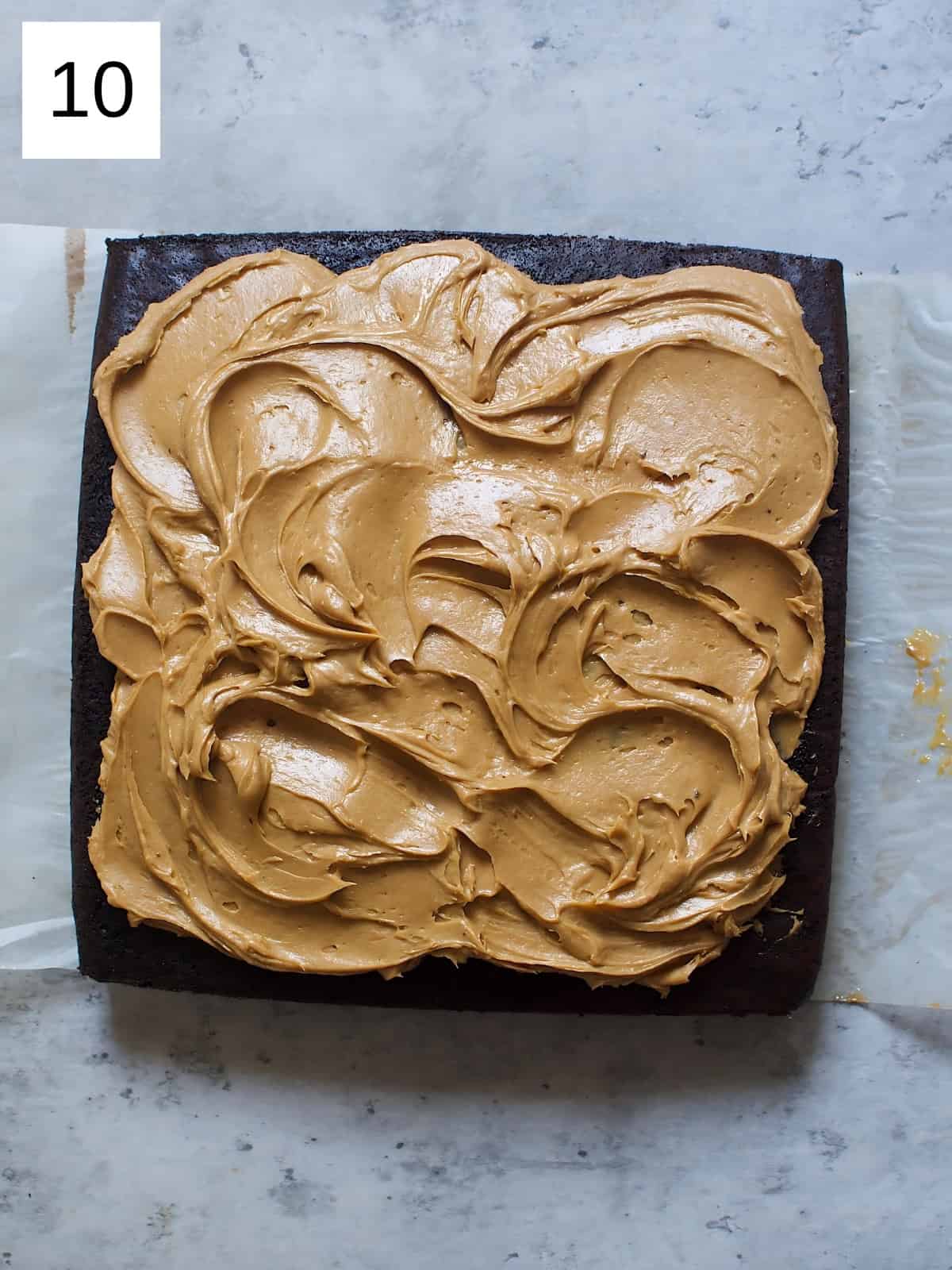 Whipped chocolate ganache on a cake.