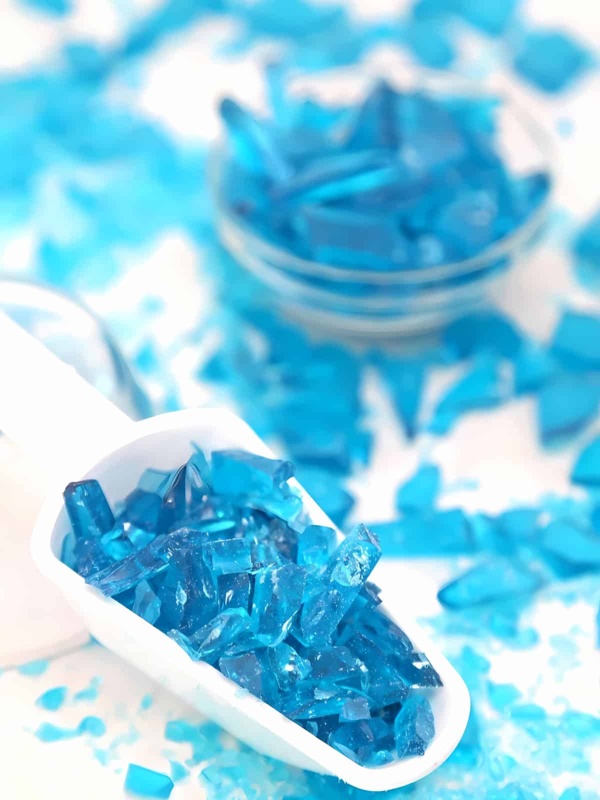 A scoop of blue crystal candies.