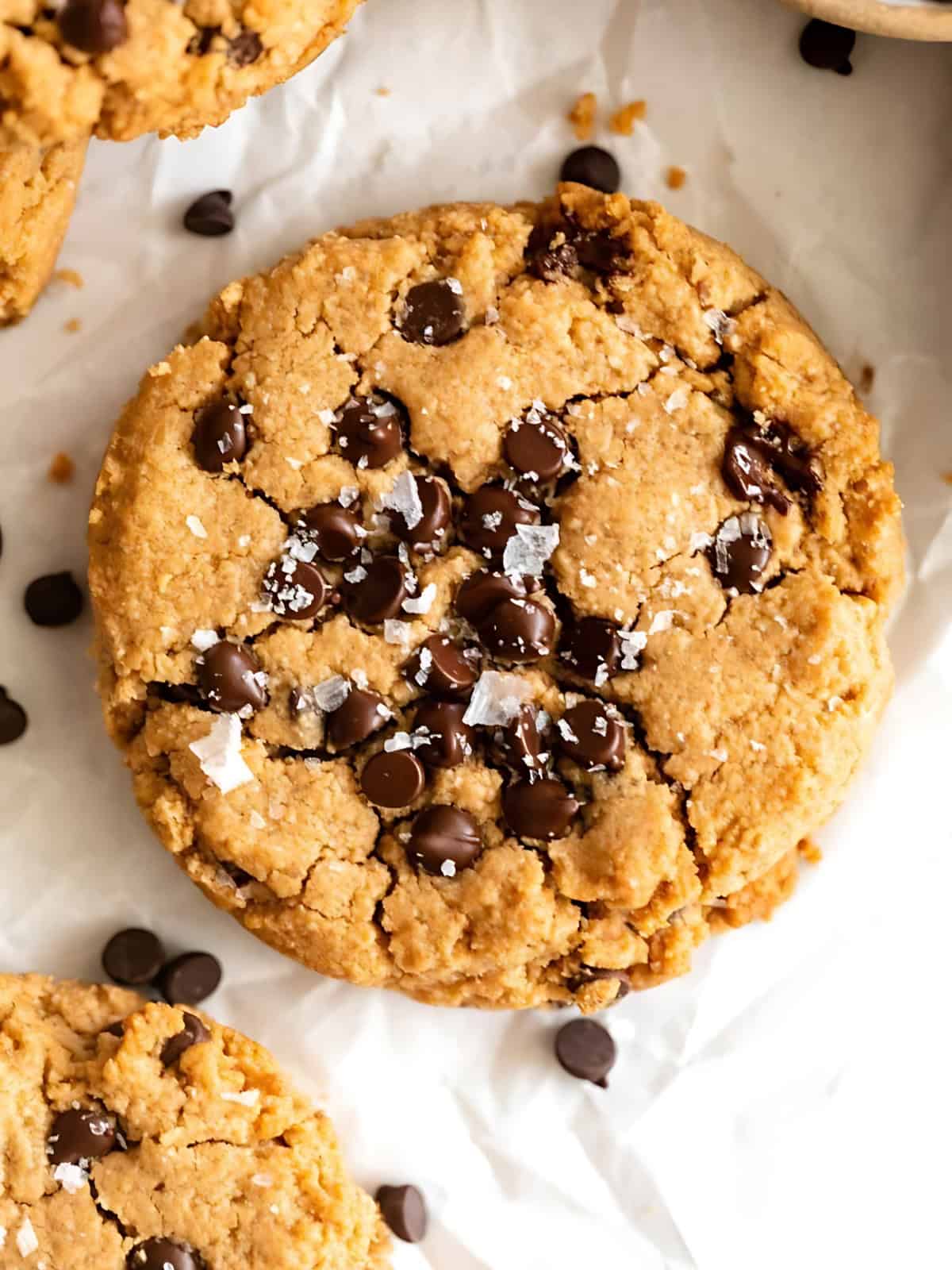 Vegan peanut butter chocolate chip cookies sprinkled with salt.