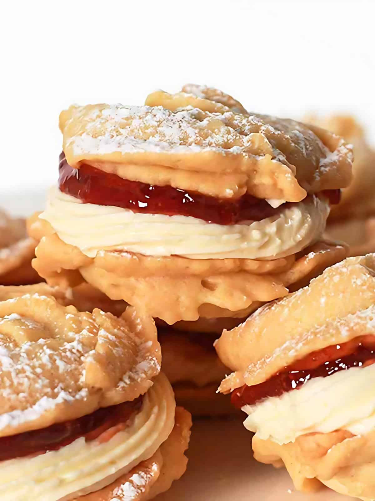 Vegan Viennese whirls sprinkled with powdered sugar.