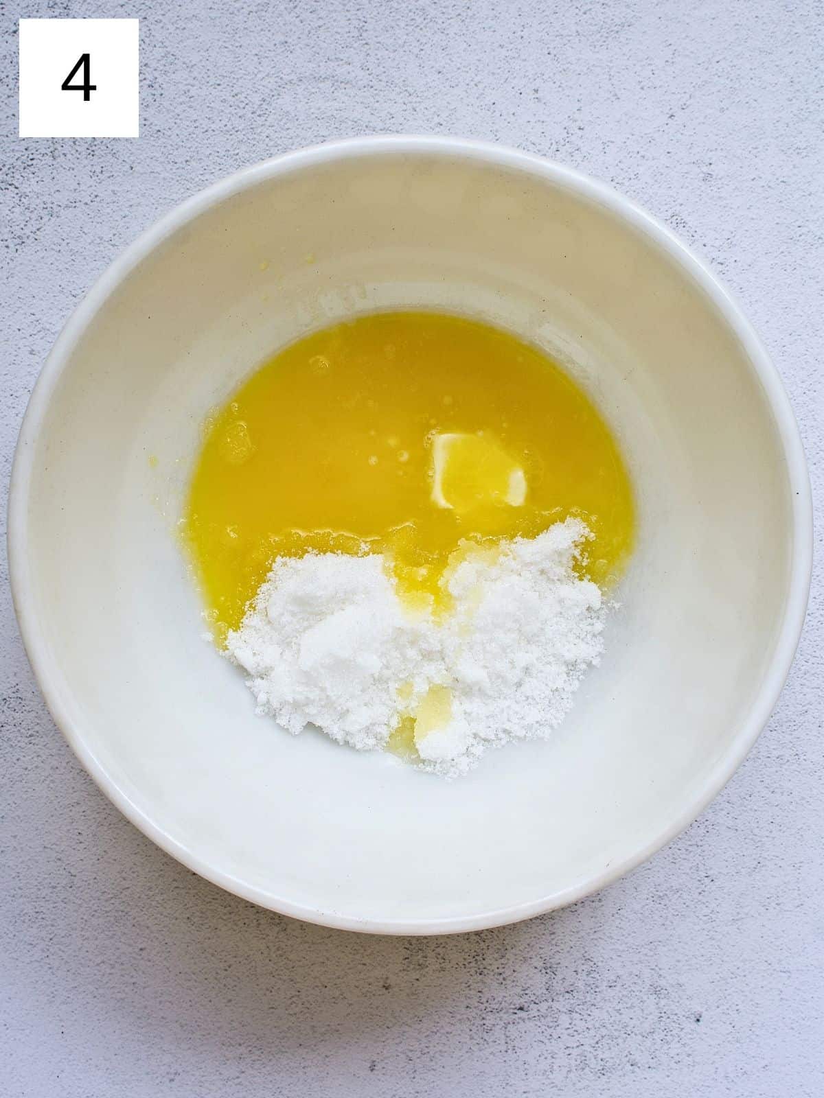 A bowl of melted butter and sugar.