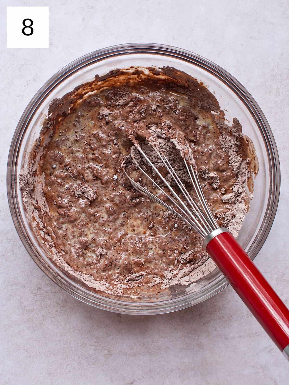 Whisking the combined ingredients in a bowl.