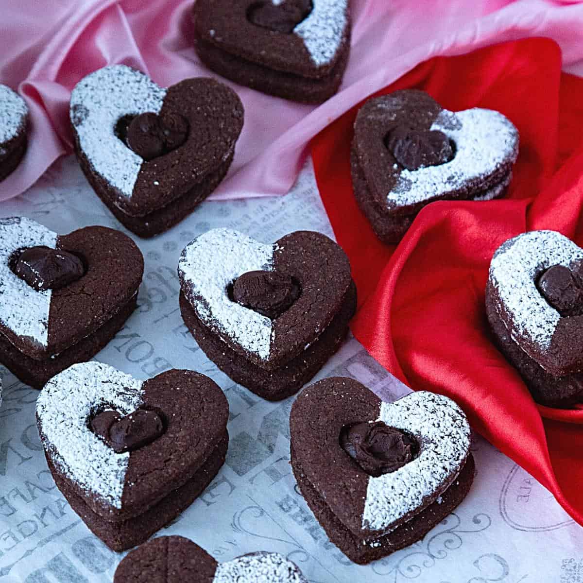 Chocolate heart cookies with powdered sugar.