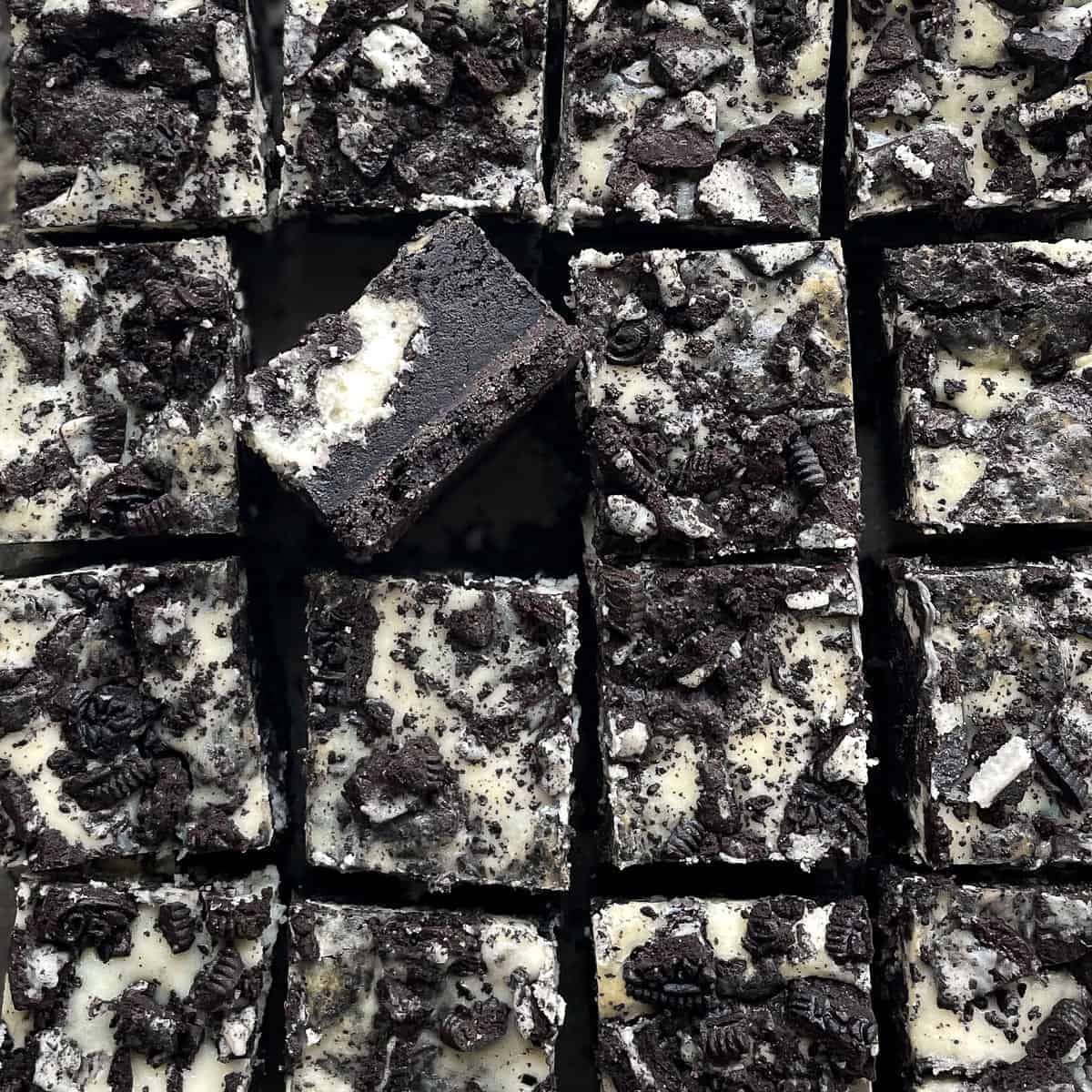 Oreo cheesecake brownies covered with oreo crumbs.