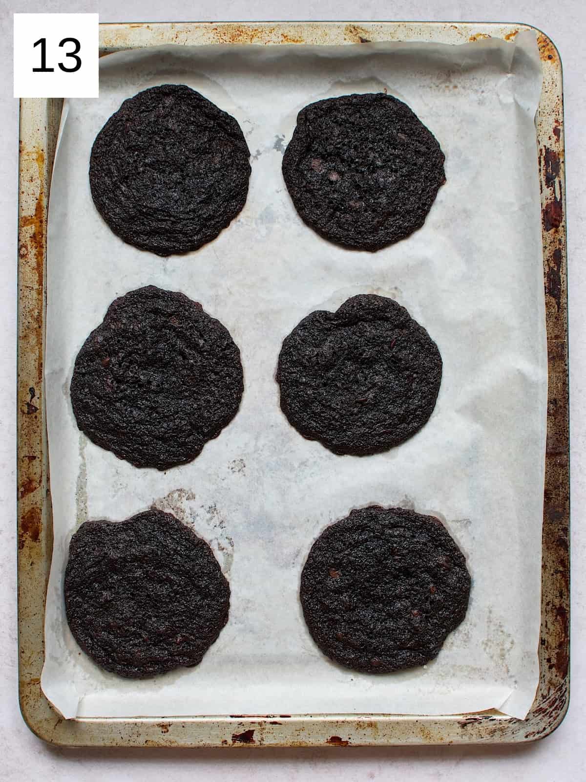 freshly baked brownie cookies arranged on a baking tray.