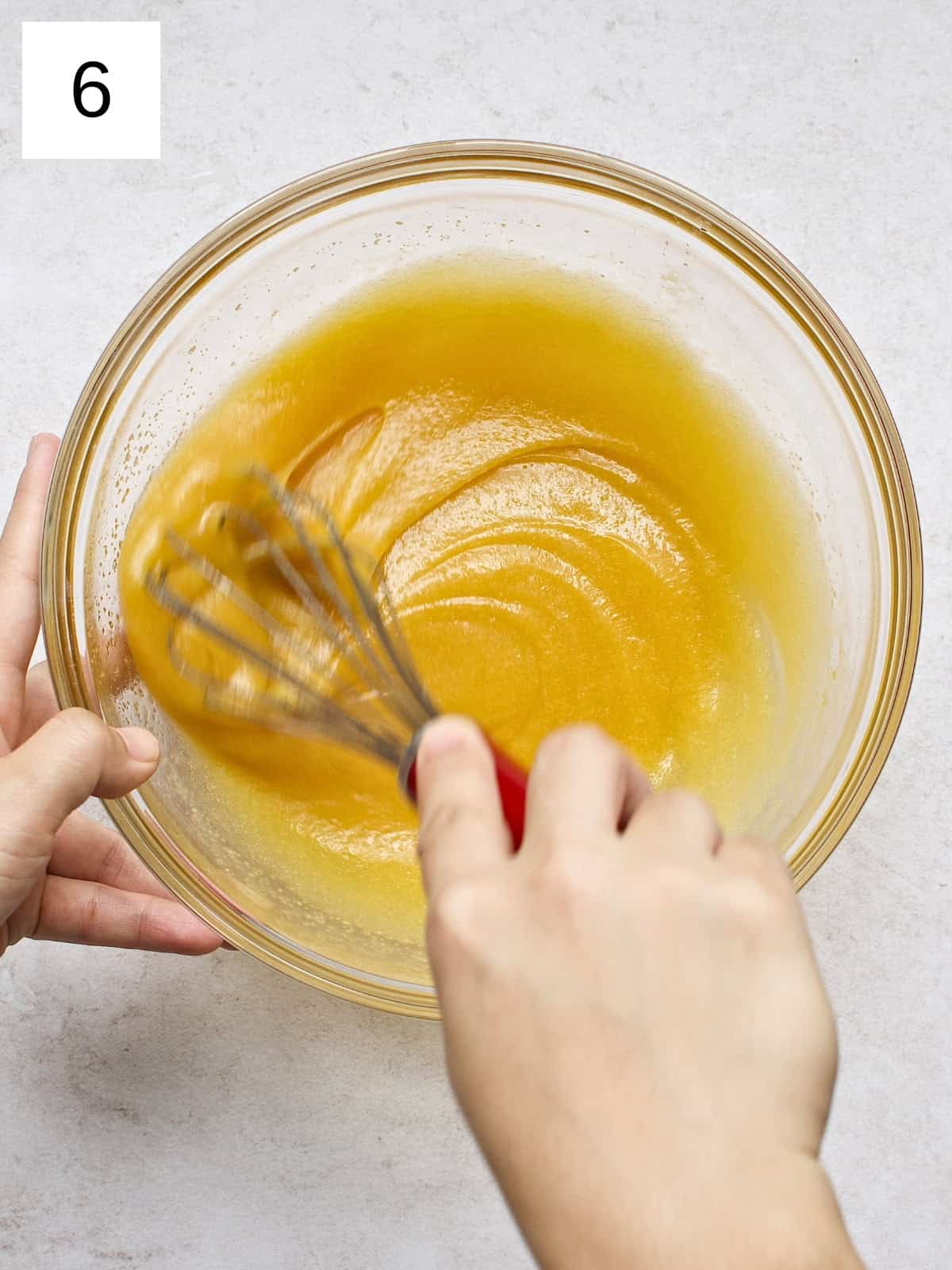 step 6 of making brownie cookies, showing a well-beaten mixture of egg and butter.