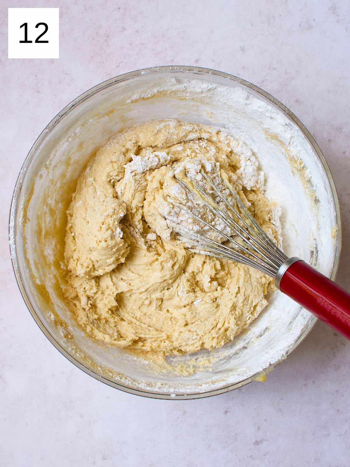 A bowl filled with a blend mixture of flour and butter.