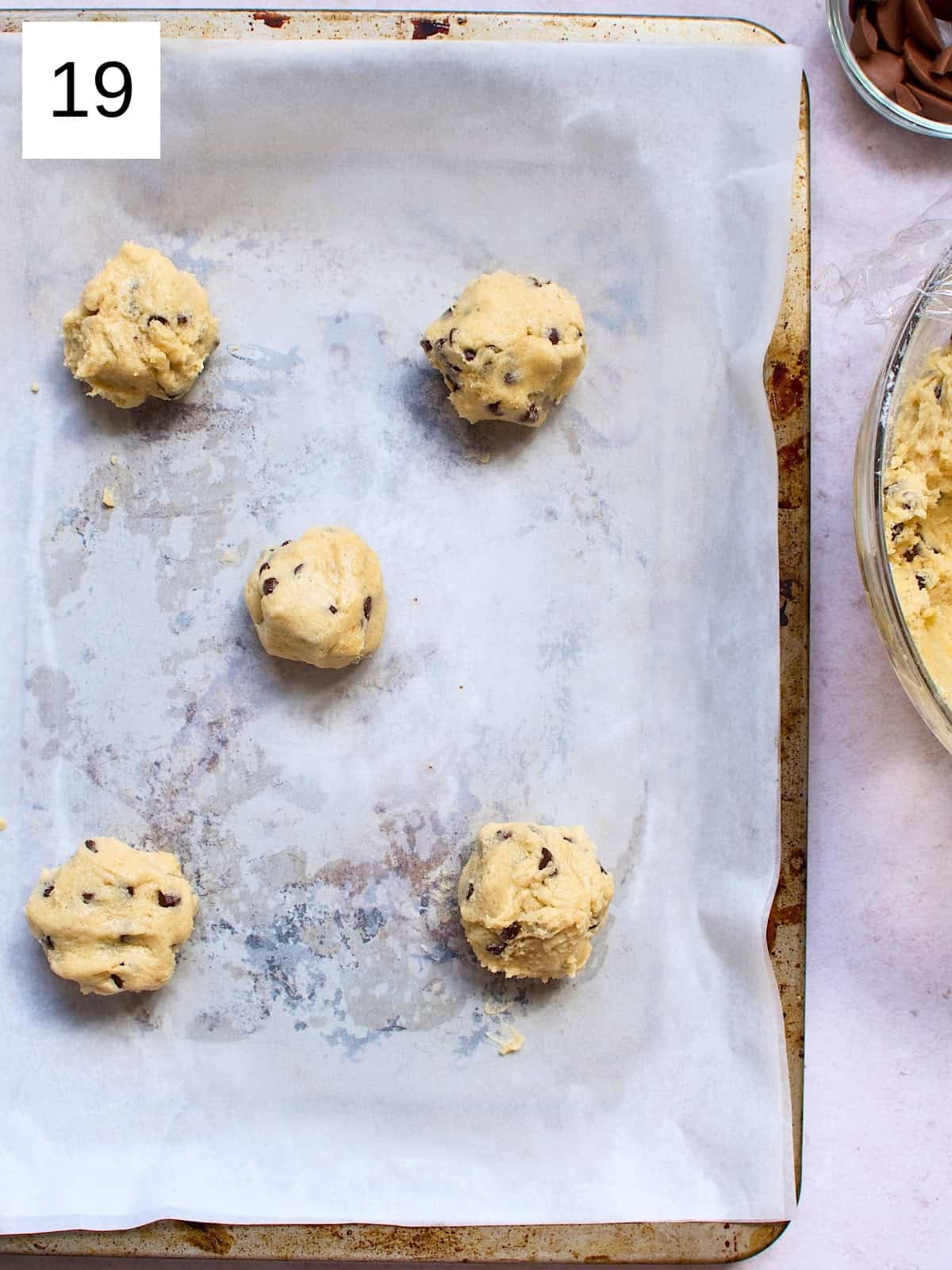 Perfectly scooped cookie batter on a baking tray, ready to be baked into delicious, golden cookies.