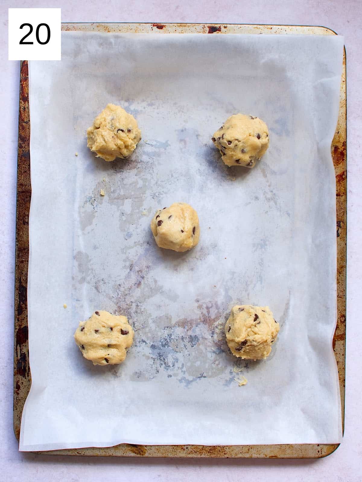 Perfectly scooped cookie batter on a baking tray, ready to be baked into delicious, golden cookies.