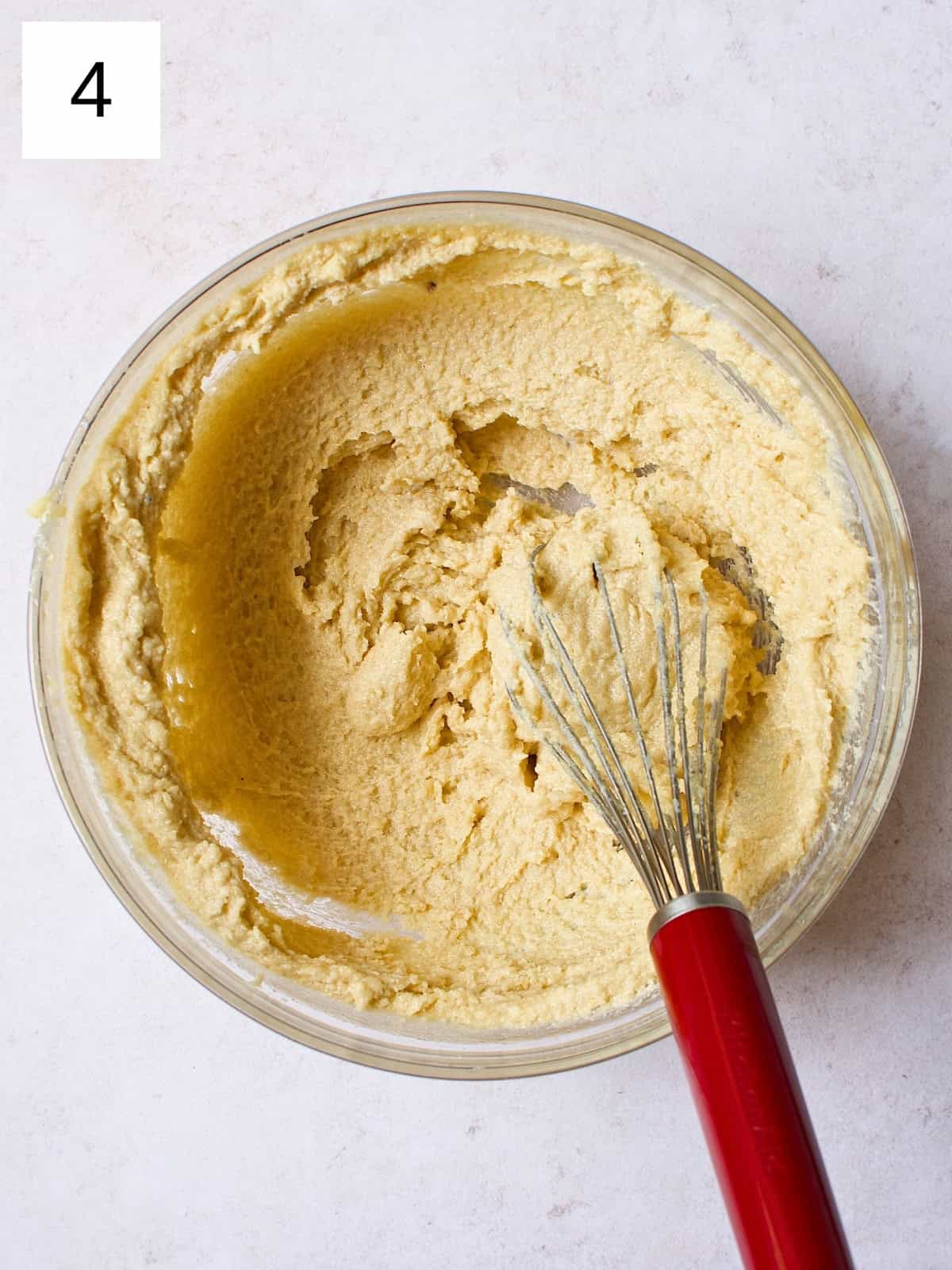 A bowl filled with a mixture of butter, granulated sugar, and brown sugar.